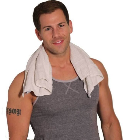 Chad Olson head shot in gray tank top with a towel